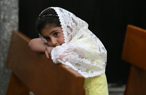 Christian child prays in Church in Iraq &#8211; fr