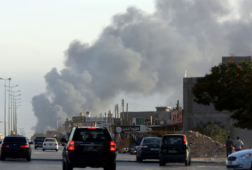 LIBYA, Tripoli : Smoke billows from an area near Tripoli&rsquo;s international airport as fighting between rival factions