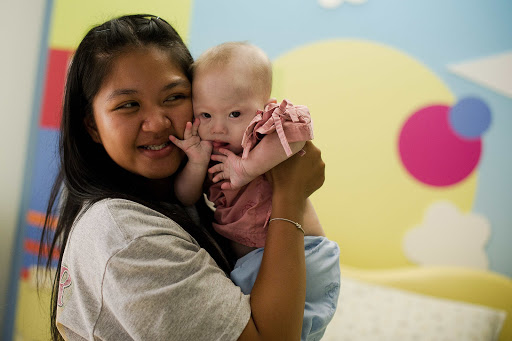 THAILAND, Siriracha : Thai surrogate mother Pattaramon Chanbua (L) holds her baby Gammy