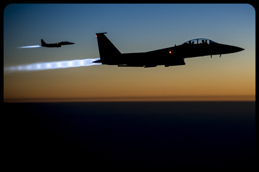 Two U.S. Air Force F-15E Strike Eagle aircraft fly over northern Iraq Sept. 23, 2014, after conducting airstrikes in Syria &#8211; fr