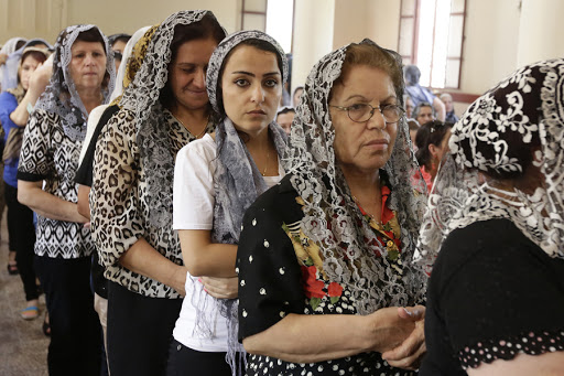 Assyrian Christians from Iraq, Syria and Lebanon attend a mass