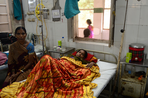 Indian patients, recovering after complications following a sterilisation operation