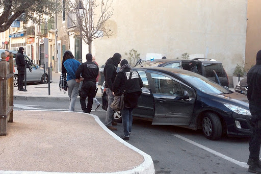 Police officers arresting a person during an anti-jihadist operation in Lunel &#8211; AFP &#8211; fr