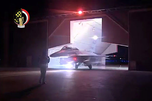 a Egyptian F-16 fighter jet preparing to take off in the early morning from an undisclosed location to conduct air strikes against Islamic State (IS) group targets in Libya.