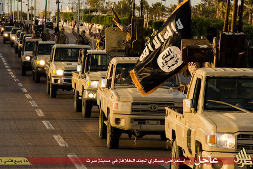 Members of the Islamic State (IS) militant group parading in a street in Libya&rsquo;s coastal city of Sirte