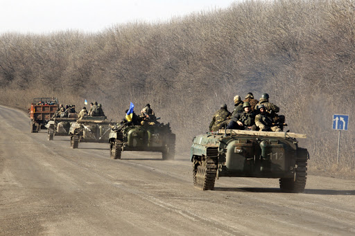 A column of Ukrainian forces rides on February 22, 2015 near Artemivsk, in the Donetsk region, eastern Ukraine.
