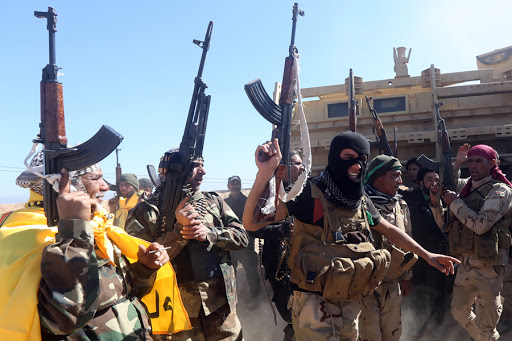 Iraqi pro-government fighters celebrate as they advance into Tikrit &#8211; AFP &#8211; fr