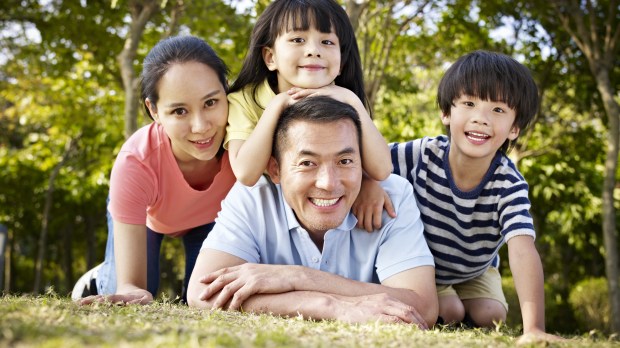 happy asian family with two children taking a family photo outdoors in a park &#8211; © Imtmphoto / Shutterstock_278316929
