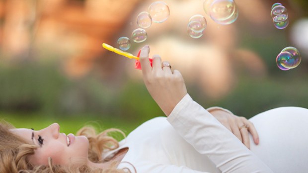 pregnant-bubbles-woman-laying-shutterstock
