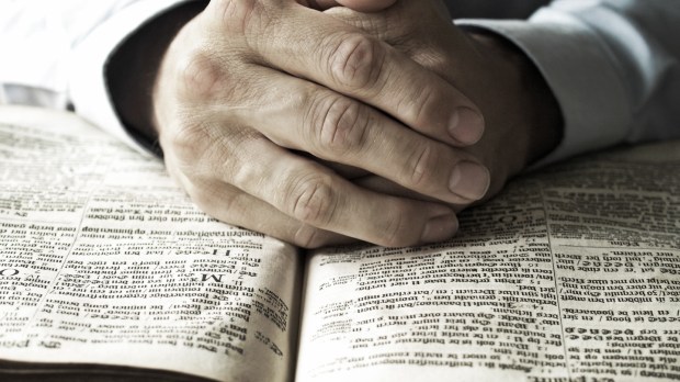 web-bible-hands-pray-read-c2a9-twin-design-shutterstock.jpg