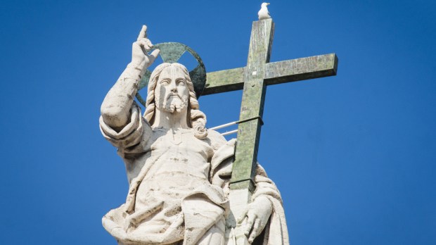 Statue of Jesus on the top of Saint Peter Basilica facade