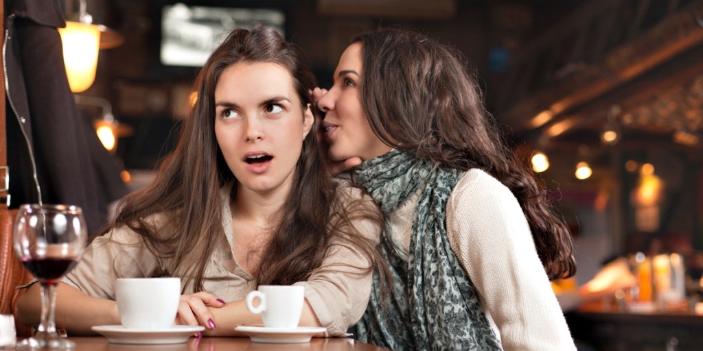 WEB3 TWO WOMEN CAFE BAR FRIENDS GOSSIP SECRETS Shutterstock