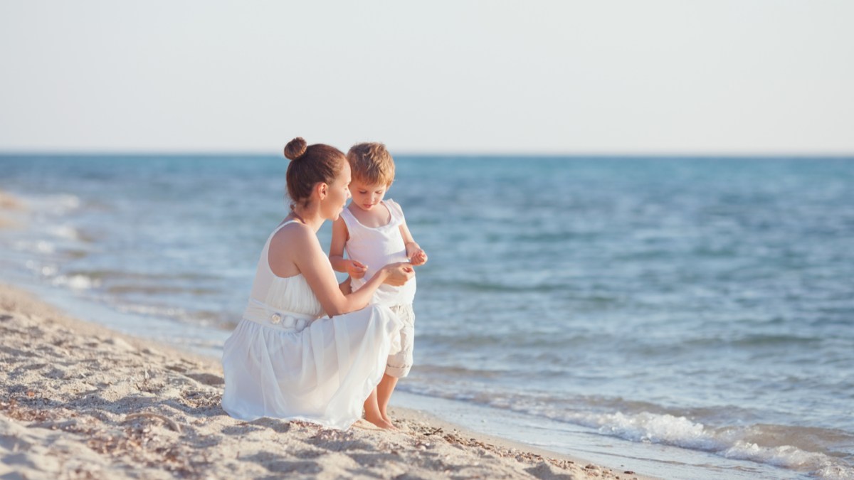 MOTHER AND SON NEAR THE SEA
