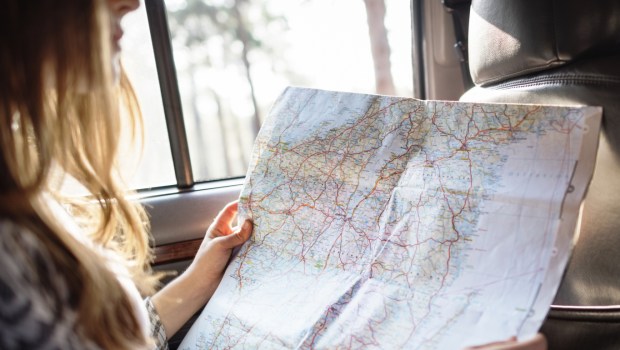 WOMAN READING A MAP