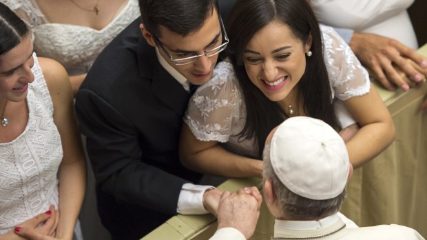 Pope Francis greets brides