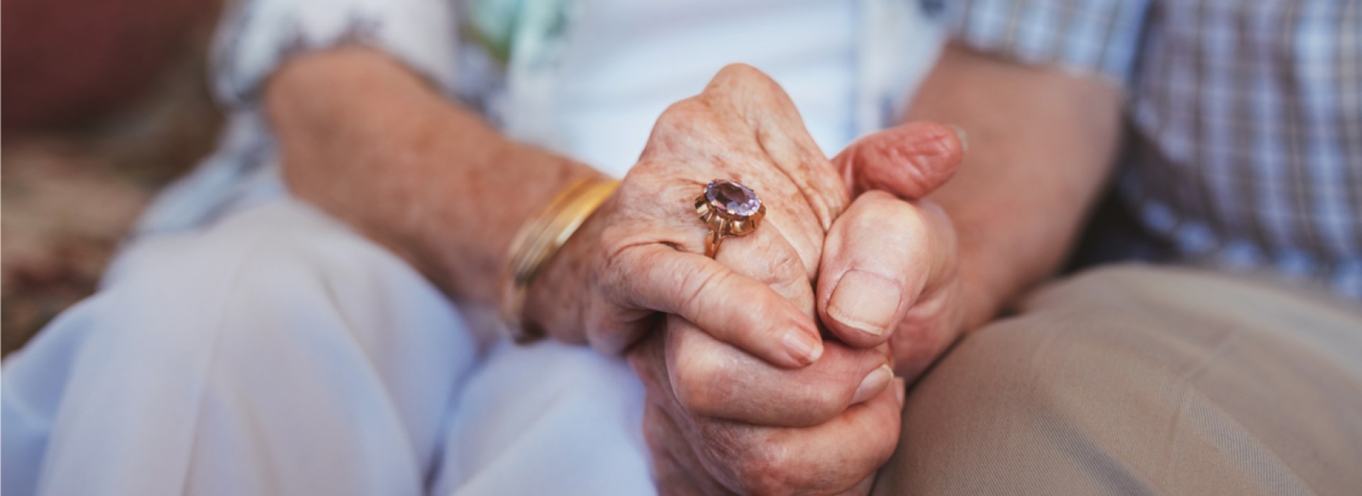 OLD COUPLE HAND IN HAND