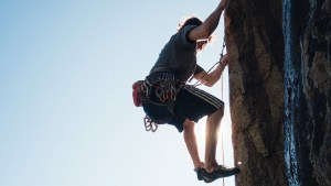 MAN CLIMBING