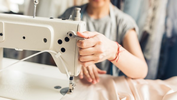 WOMAN SEWING