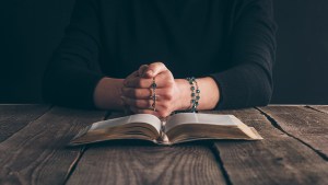 Woman Praying rosary