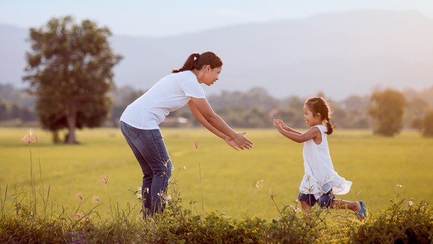 CHILD RUNNING TO HUG HER MOTHER