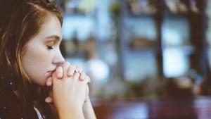 WOMAN PRAYING