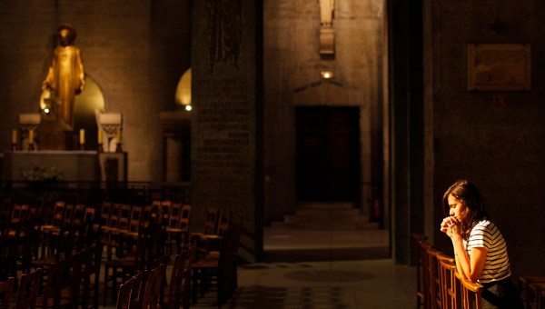 GIRL PRAYING IN CHURCH
