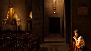 GIRL PRAYING IN CHURCH