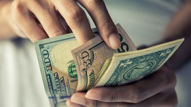 American dollars bank note in hand , Businesswoman hands counting money , Copy space , Business and Income concept.