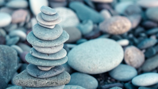 WEB2 &#8211; Stack of stones on beach &#8211; nature background. Stone cairn on green blurry background, pebbles and stones. Concept balance &#8211; Image -shutterstock_1231462825.jpg