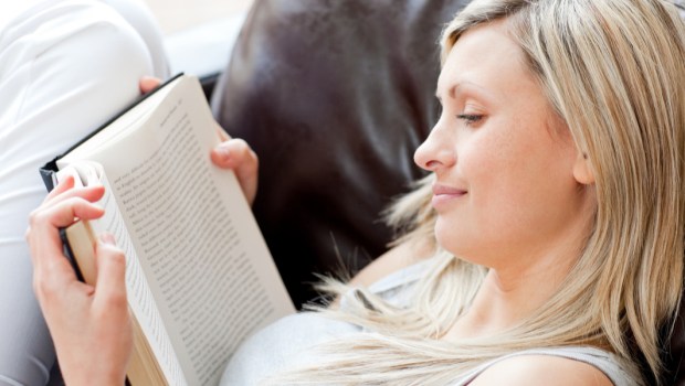 WOMAN READING,