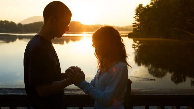 PRAYING COUPLE