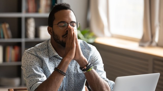 man praying at work, prayer before beginning work, sanctify daily work