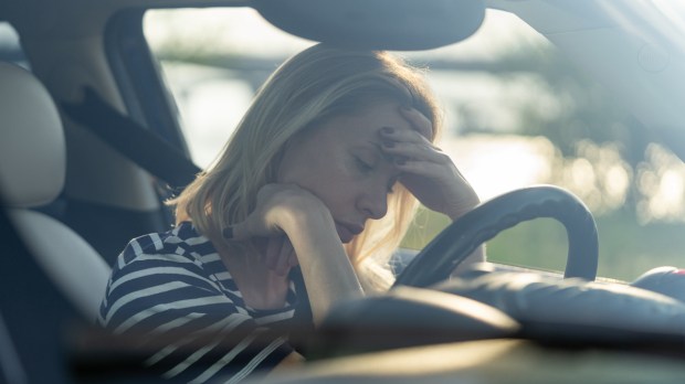 Depressed middle woman driver sitting inside car feeling doubtful confused about difficult decision suffering from personal psychological problem