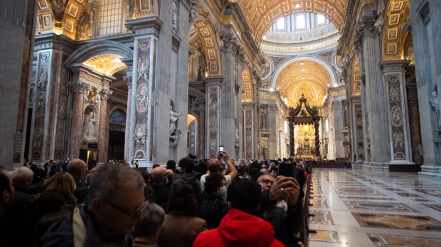 People wait in line to see the body of Pope Emeritus Benedict XVI