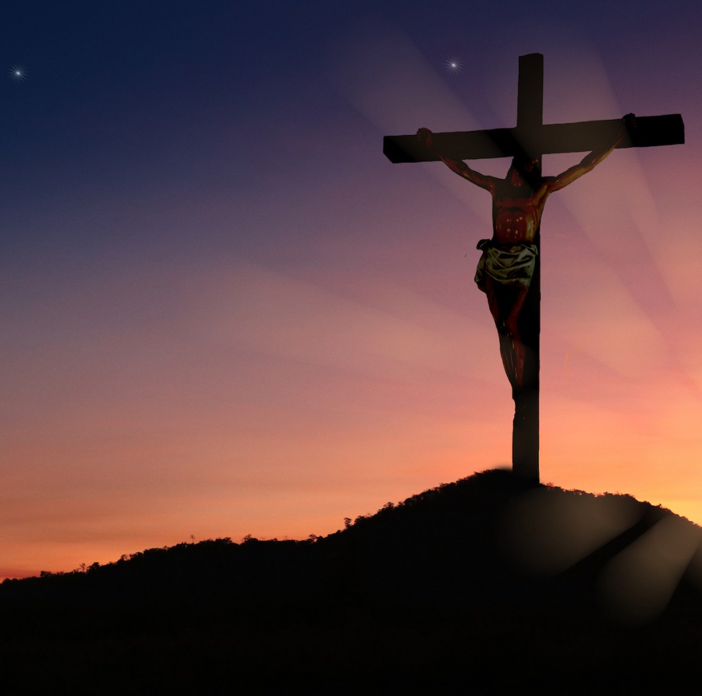 The crucifixion of Jesus Christ on the mountain has a background as before the sunset