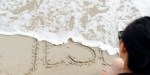 The-word-God-in-the-sand-washed-away-by-the-sea-Vietnam-Godong