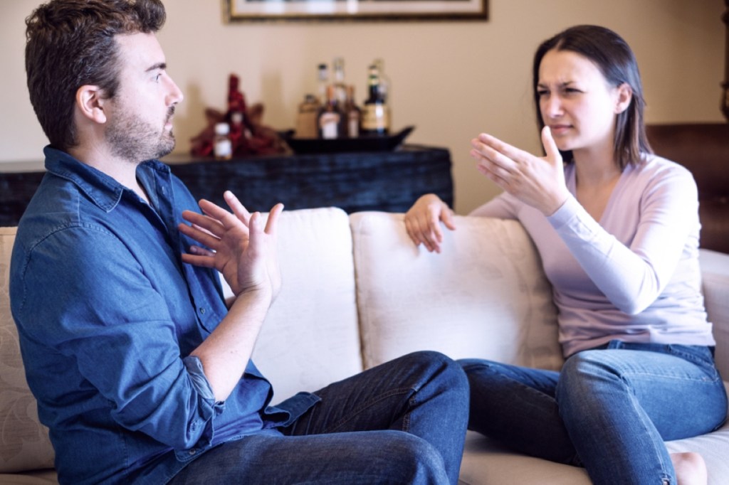 Sad couple with problems at home feeling bad and arguing