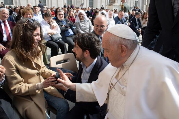Pope Francis blesses the engagement ring at the general audience on May 03, 2023 in St. Peter's Square at the Vatican.