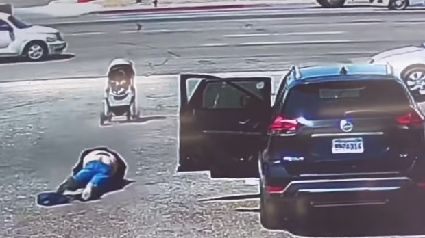 Stroller-with-a-baby-inside-gets-blown-by-the-wind-towards-the-street