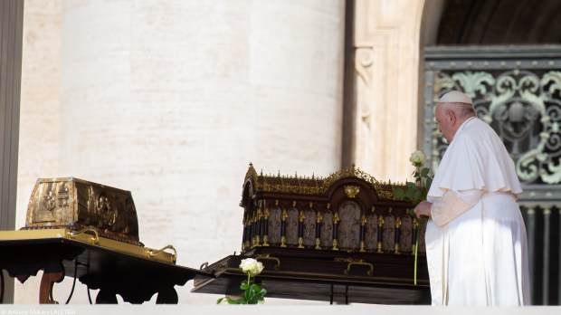 Pope Francis stands by the relics of Saint Therese of Lisieux