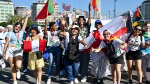 Pilgrims attend the opening mass of the World Youth Day 2023