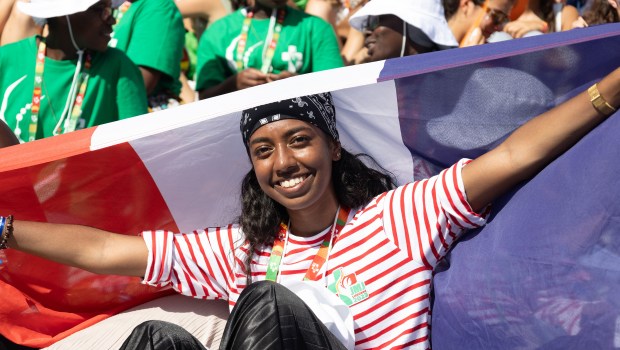 Pilgrims attend the opening mass of the World Youth Day 2023