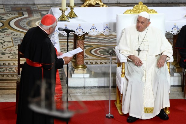 Pope-Francis-listens-to-the-welcome-speech-of-Marseilles-Archbishop-and-Cardinal-Jean-Marc-Aveline