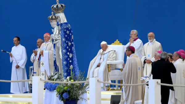 Pope Francis waves as he arrives to celebrate mass at the Velodrome stadium in the southern port city of Marseille
