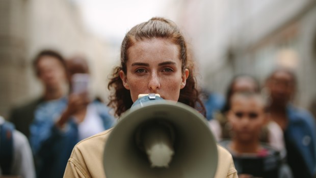 PROTEST-WOMAN-shutterstock_1768715813