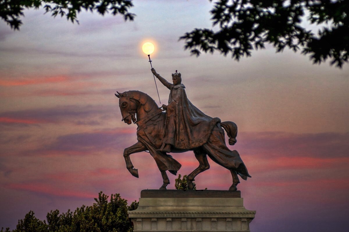 The moon over the Apotheosis of St. Louis statue of King Louis IX of France, namesake of St. Louis, Missouri in Forest Park, St. Louis, Missouri