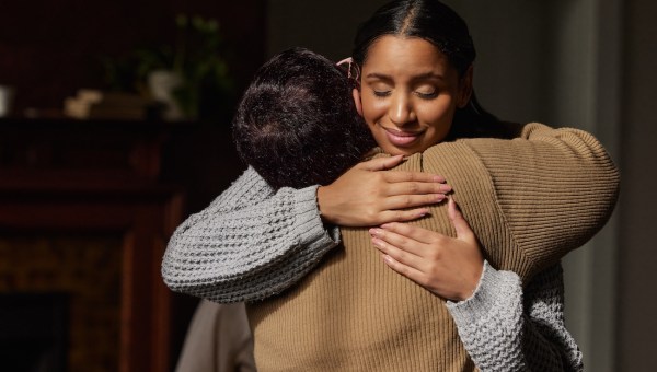 gratitude thankful woman smile happy hug embrace