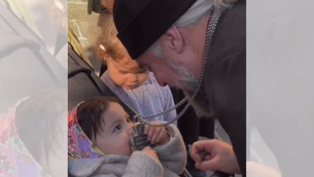 orthodox girl kissing the cross
