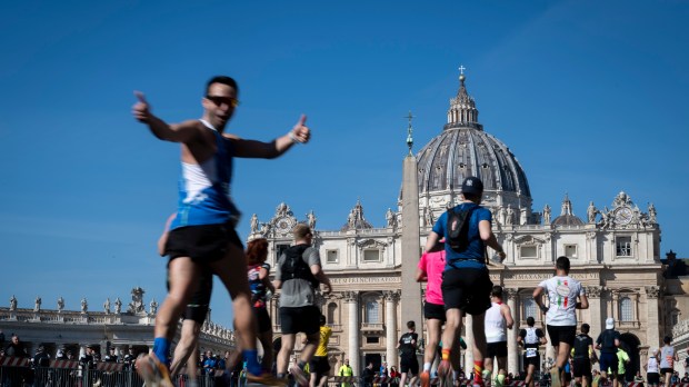 Competitors run in front of St. Peter's square during the Rome Marathon in Rome