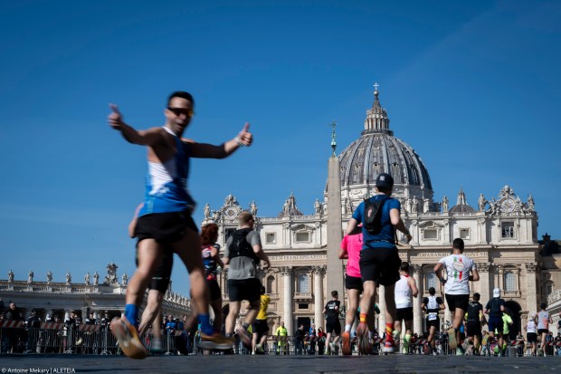 Competitors run in front of St. Peter's square during the Rome Marathon in Rome